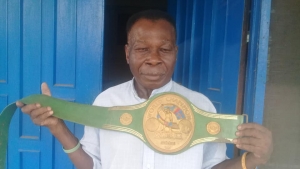 WBC awards D K Poison with new title belt.
