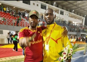James Thompson congratulates Rasheed Saminu for breaking 100m record twice this year