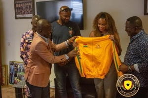 Asafa Powell, wife and GOC President pay courtesy call on Director General of National Sports Authority
